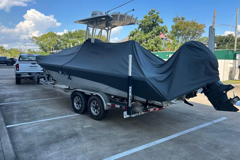 Slide: The Image of Covered 2019 Pathfinder 2600 HPS boat on trailer, parked in a lot, sunny day. - 5