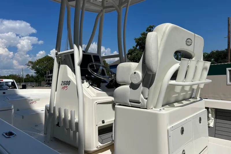 Slide: The Image of 2019 Pathfinder 2600 HPS boat interior with steering console and seating. - 8
