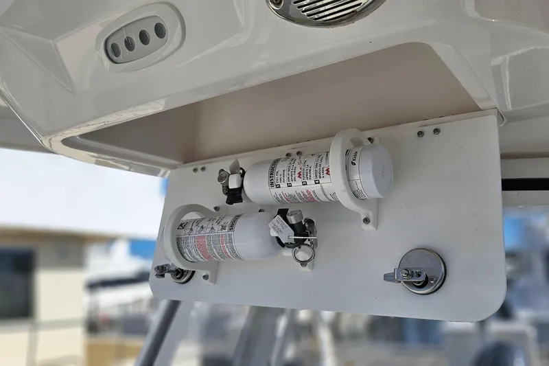 Slide: The Image of 2024 Sea Fox 268 Commander fire extinguisher setup under boat console. - 11