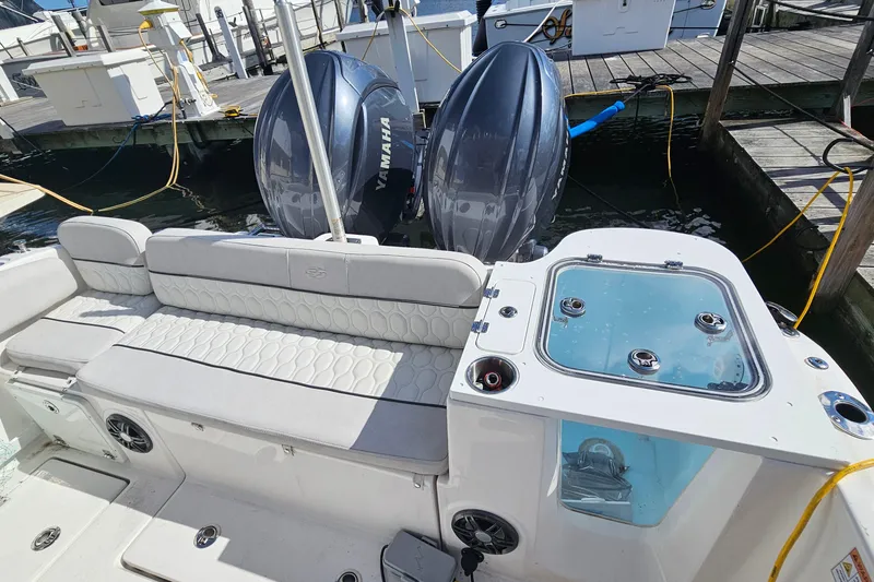 Slide: The Image of 2024 Sea Fox 268 Commander boat with Yamaha engines docked at marina. - 13