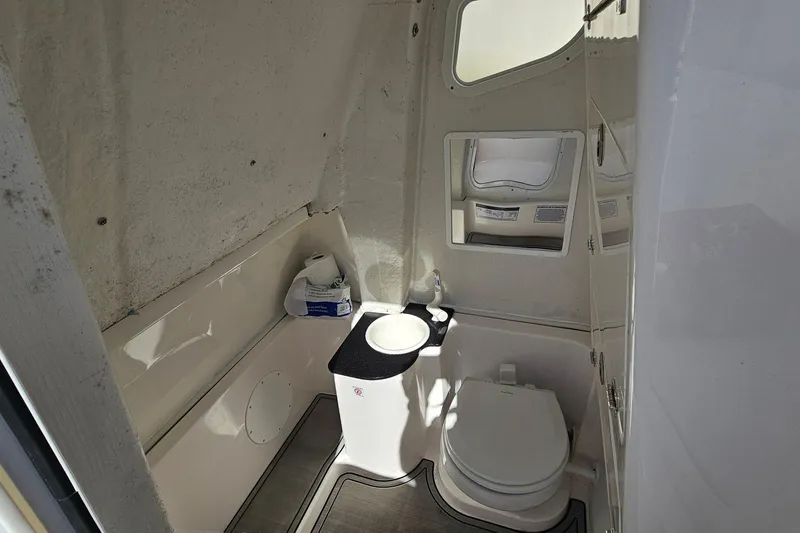 Slide: The Image of 2024 Sea Fox 268 Commander boat interior bathroom with toilet and sink. - 14