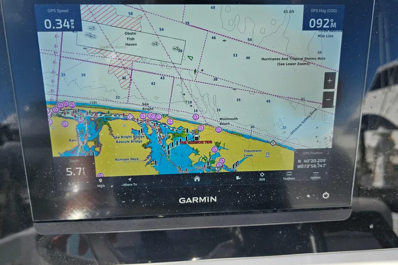 Slide: The Image of Garmin GPS display on 2024 Sea Fox 268 Commander, showing nautical chart and navigation details. - 19