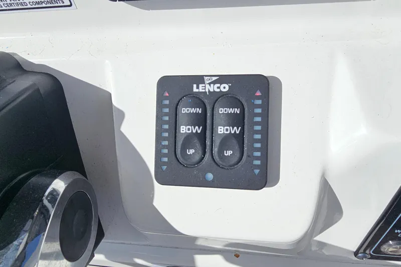 Slide: The Image of Lenco trim tab control panel on 2024 Sea Fox 268 Commander boat dashboard. - 23