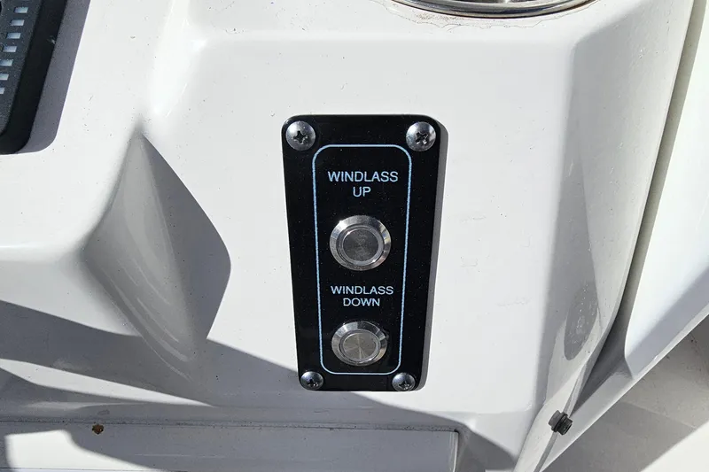 Slide: The Image of 2024 Sea Fox 268 Commander windlass control panel with up and down buttons. - 24
