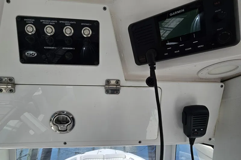 Slide: The Image of 2024 Sea Fox 268 Commander dashboard with Garmin device and control panel. - 27