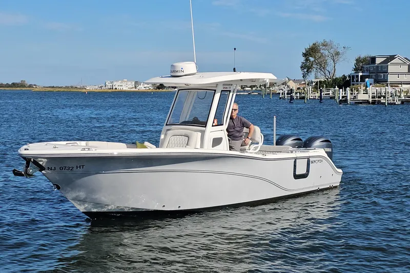 Slide: The Image of 2024 Sea Fox 268 Commander boat on water, featuring dual engines and sleek design. - 3