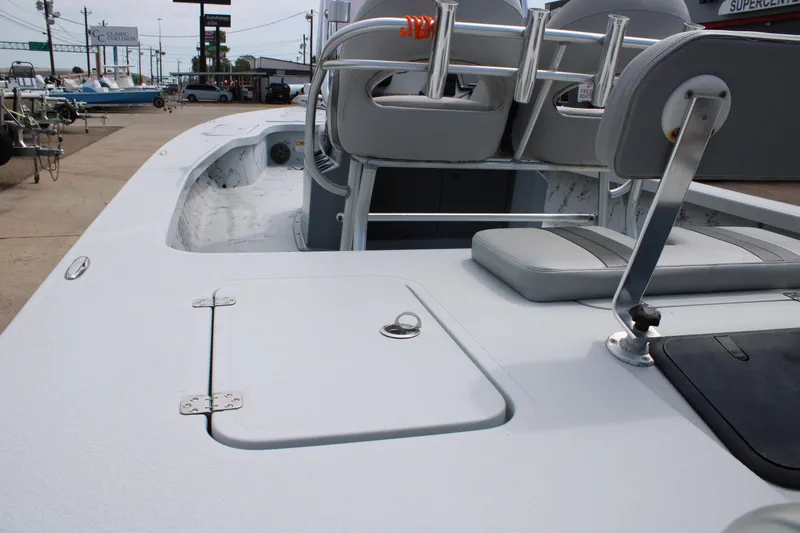 Slide: The Image of 2014 Majek Xtreme 25 boat interior with seating and storage compartments. - 10