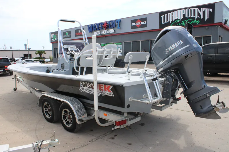 Slide: The Image of 2014 Majek Xtreme 25 boat with Yamaha engine at dealership. - 11