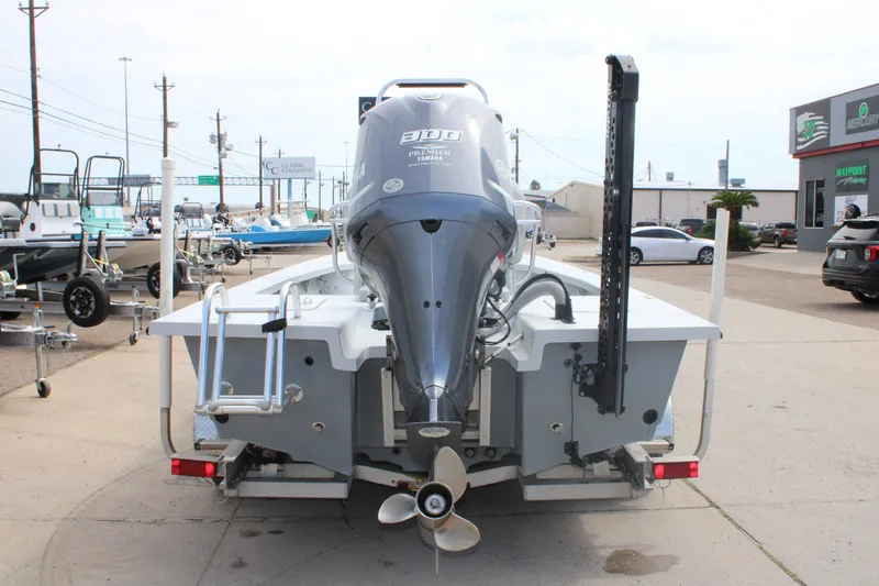 Slide: The Image of 2014 Majek Xtreme 25 boat with Yamaha engine, parked at a dealership. - 12