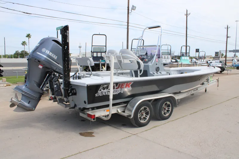 Slide: The Image of 2014 Majek Xtreme 25 boat with Yamaha engine on a trailer. - 13