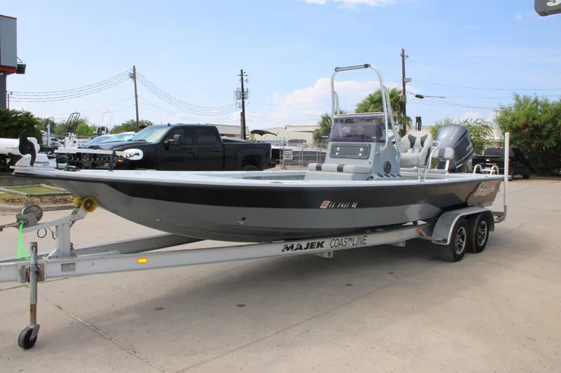 Slide: The Image of 2014 Majek Xtreme 25 boat on trailer, parked outdoors. - 15