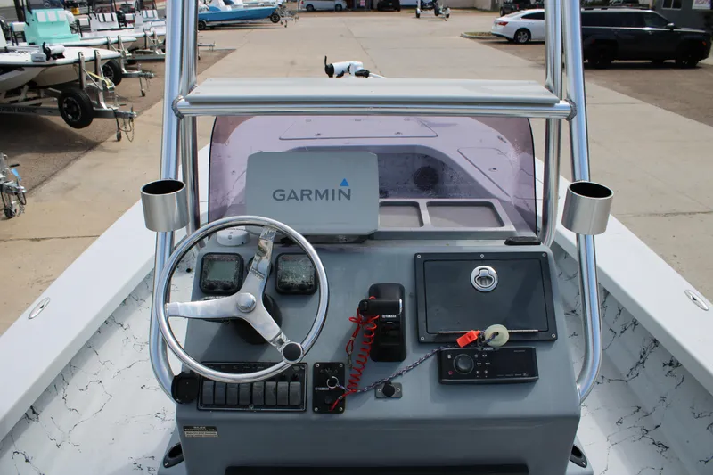Slide: The Image of 2014 Majek Xtreme 25 boat console with Garmin navigation system and steering wheel. - 3