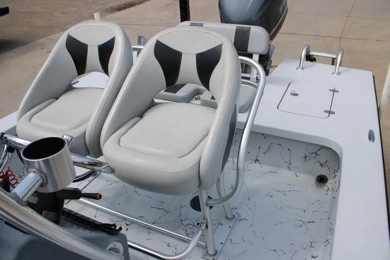 Slide: The Image of 2014 Majek Xtreme 25 boat interior with dual seats and steering console. - 6