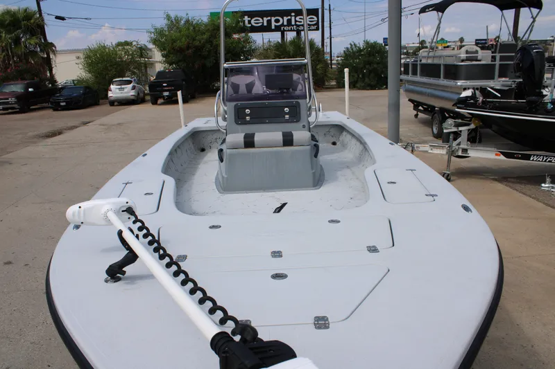 Slide: The Image of 2014 Majek Xtreme 25 boat with trolling motor, parked in a lot. - 8