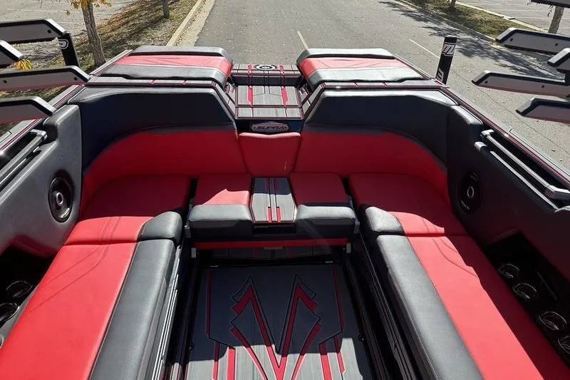 Slide: The Image of 2024 Supra SE 575 boat interior with red and black seating, showcasing luxury design. - 4