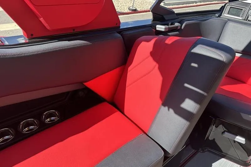 Slide: The Image of 2024 Supra SE 575 interior with red and black seating, showcasing modern design and comfort. - 9