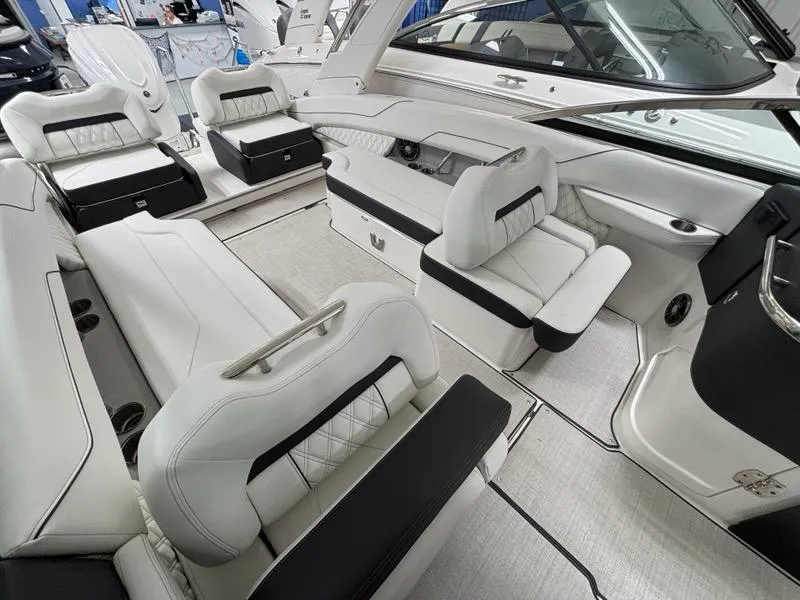 Slide: The Image of Luxurious interior of 2026 Regal LX6 boat with elegant white seating and modern design. - 26