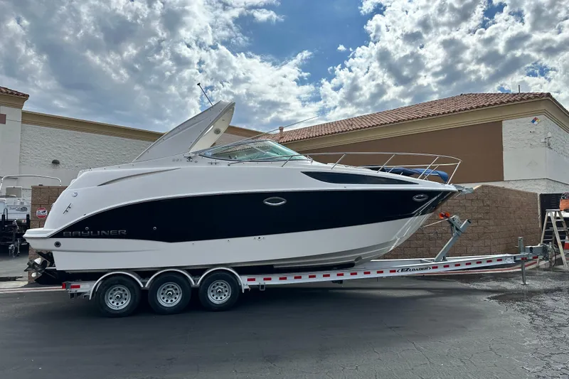 The Image of 2012 Bayliner 285 Cruiser on trailer, side view. - 0