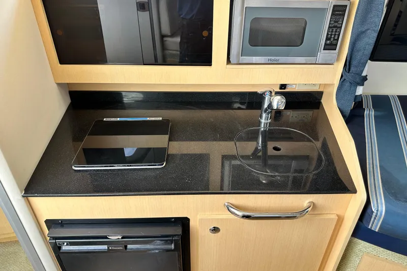 Slide: The Image of Cruisair control panel on 2012 Bayliner 285 Cruiser, displaying temperature settings. - 27