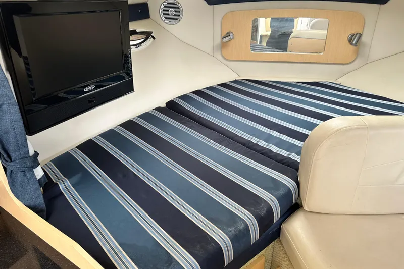 Slide: The Image of 2012 Bayliner 285 Cruiser bathroom with sink and toilet, compact and functional design. - 29