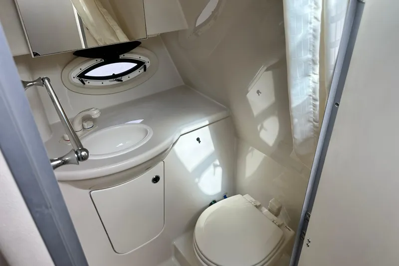 Slide: The Image of Jensen TV screen inside 2012 Bayliner 285 Cruiser boat. - 32