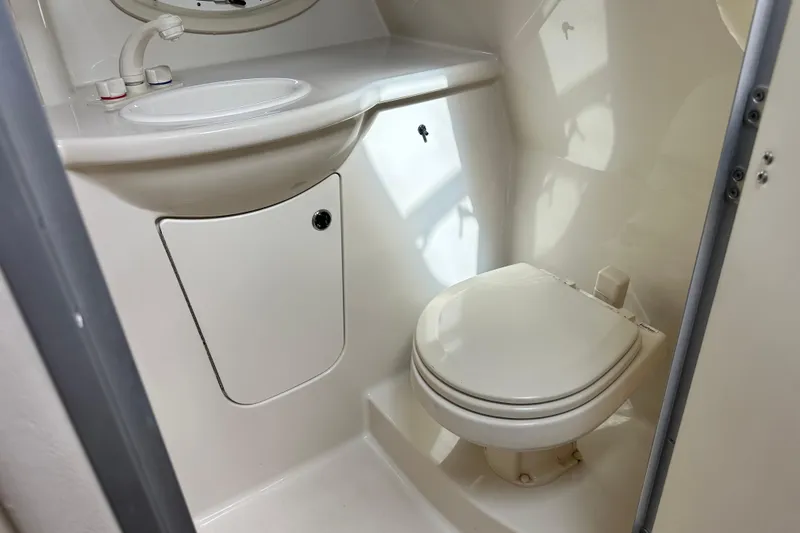 Slide: The Image of Engine of 2012 Bayliner 285 Cruiser boat, featuring a 350 MAG motor. - 33