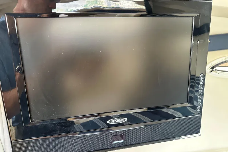 Slide: The Image of Bayliner 285 Cruiser 2012 shower controls with temperature knobs and warning label. - 36