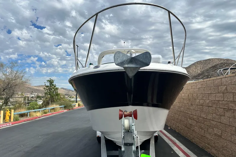 Slide: The Image of 2012 Bayliner 285 Cruiser boat stern with propeller and trailer detail. - 8