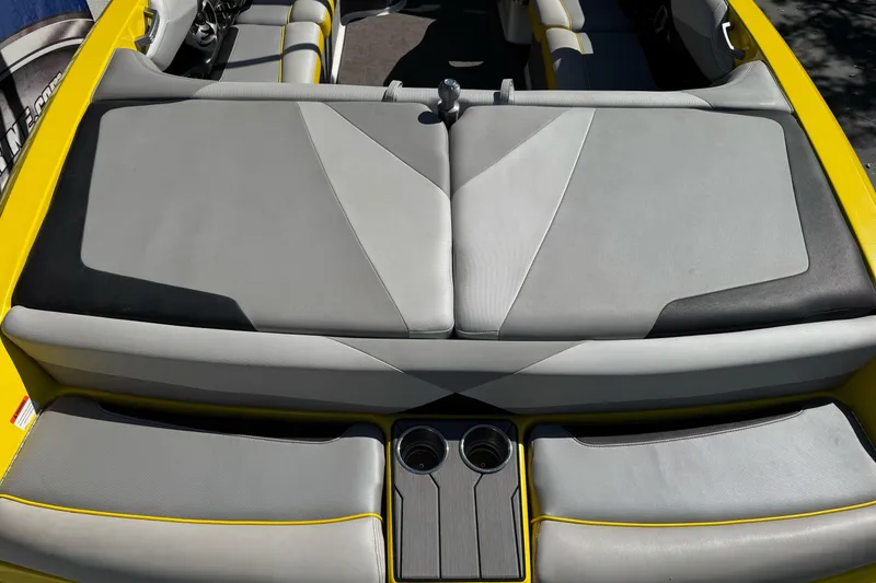 Slide: The Image of 2017 Malibu Wakesetter 23 LSV boat interior with gray and yellow seating. - 10