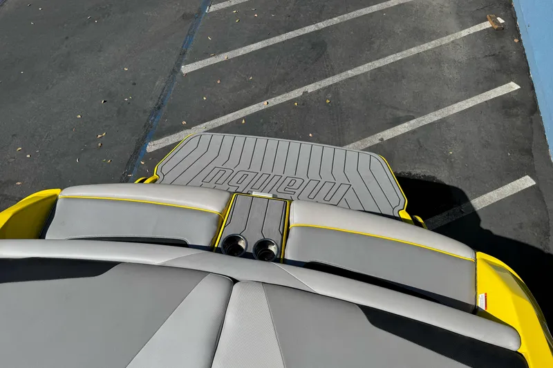 Slide: The Image of 2017 Malibu Wakesetter 23 LSV boat interior with gray and yellow seating. - 12