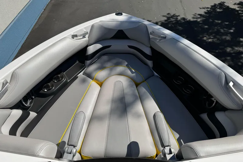 Slide: The Image of 2017 Malibu Wakesetter 23 LSV boat interior with gray seating and cup holders. - 15