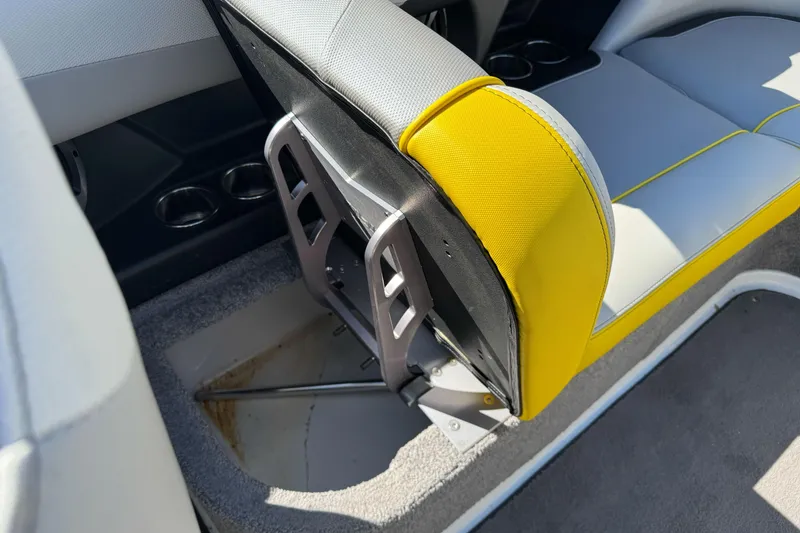 Slide: The Image of 2017 Malibu Wakesetter 23 LSV interior seat detail with yellow and gray upholstery. - 30