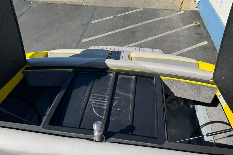 Slide: The Image of 2017 Malibu Wakesetter 23 LSV boat interior with storage compartments and seating. - 32