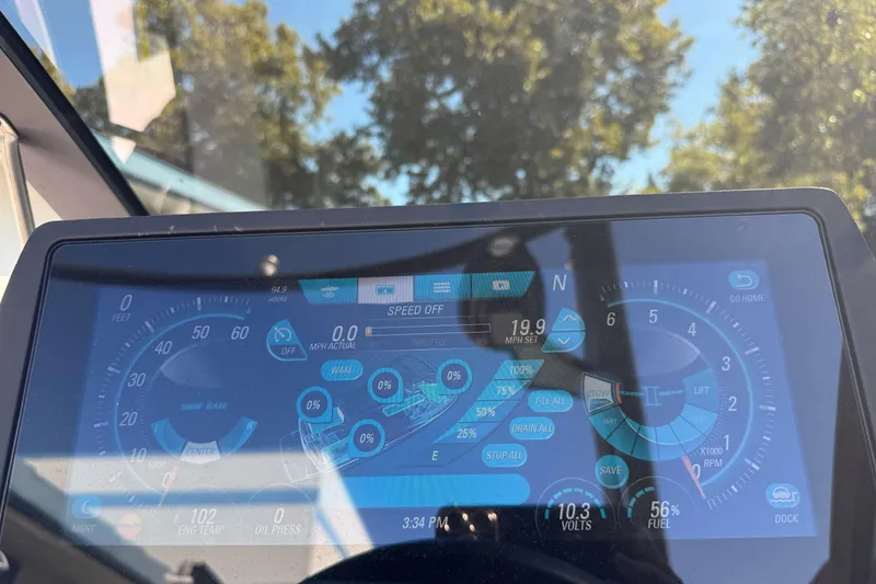 Slide: The Image of Dashboard of a 2017 Malibu Wakesetter 23 LSV boat with digital controls and gauges. - 37