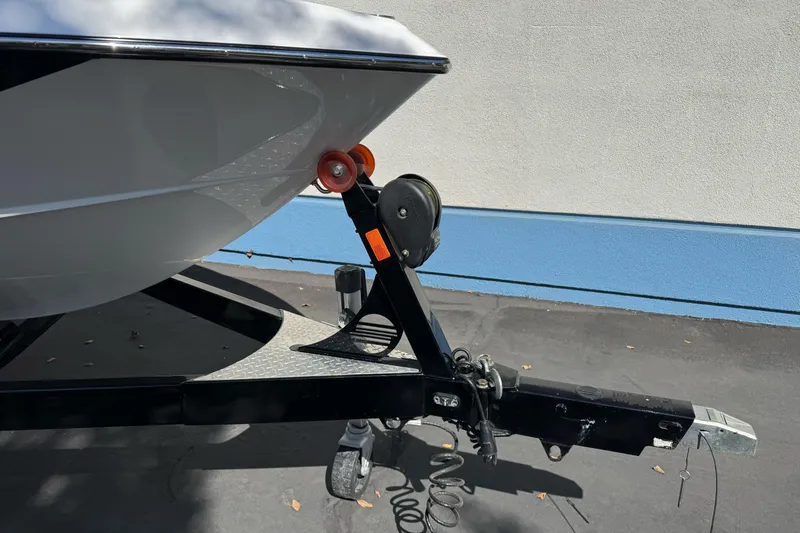 Slide: The Image of 2017 Malibu Wakesetter 23 LSV boat trailer hitch close-up, parked on pavement. - 8