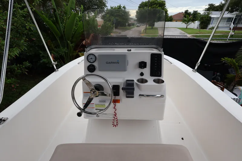 Slide: The Image of 2016 Robalo R160 Center Console boat interior with Garmin navigation system. - 16