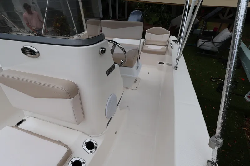 Slide: The Image of 2016 Robalo R160 Center Console boat interior with seating and steering wheel. - 20