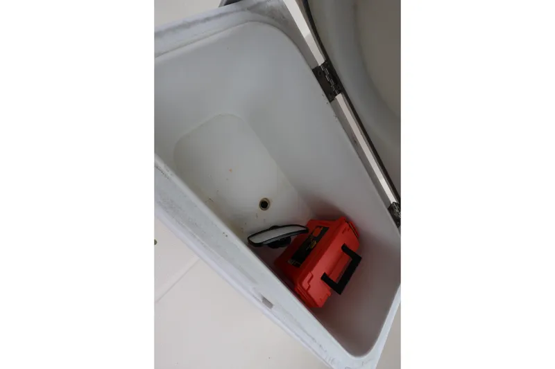 Slide: The Image of Open storage compartment in 2016 Robalo R160 Center Console boat. - 36