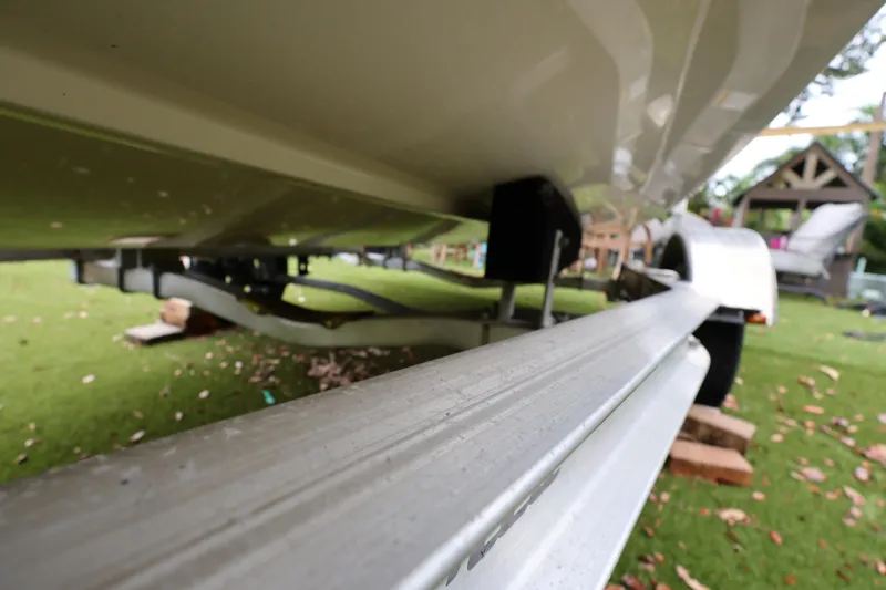 Slide: The Image of 2016 Robalo R160 Center Console boat on trailer, close-up view. - 38