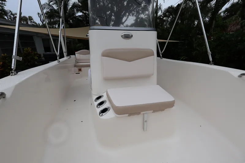 Slide: The Image of 2016 Robalo R160 Center Console boat interior with seating and console view. - 5