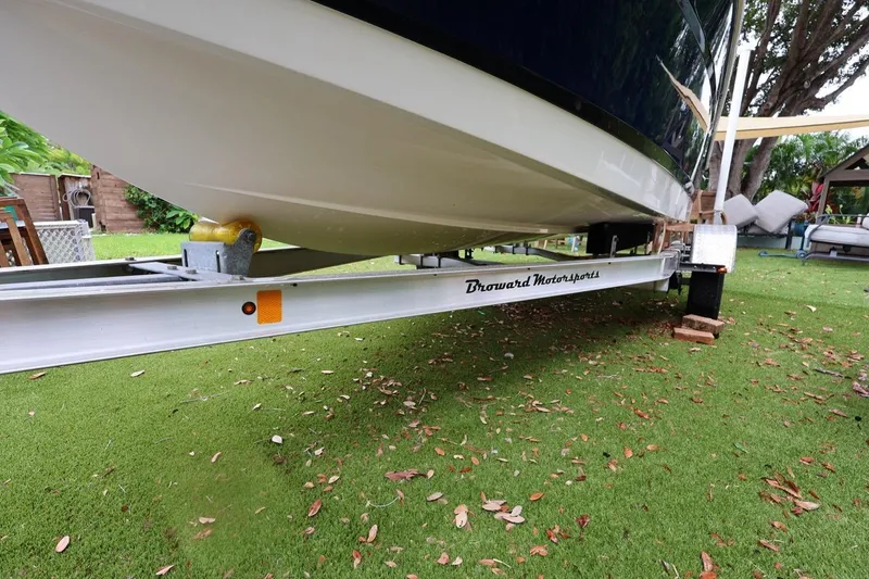 Slide: The Image of 2016 Robalo R160 Center Console boat on trailer, parked on grass. - 50