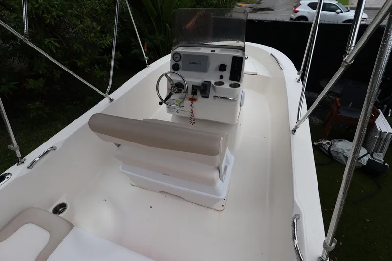 Slide: The Image of 2016 Robalo R160 Center Console boat interior with steering wheel and seating. - 6
