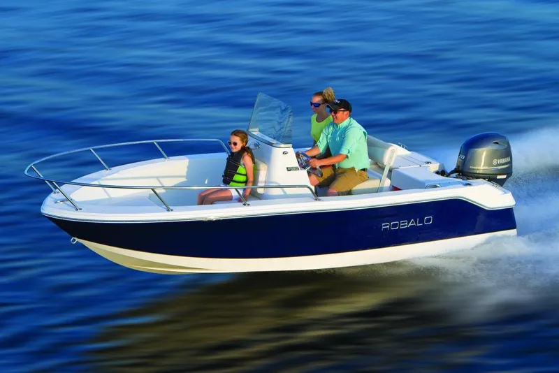 Slide: The Image of Manufacturer Provided Image: 2016 Robalo R160 Center Console boat cruising on water with three passengers. - 8