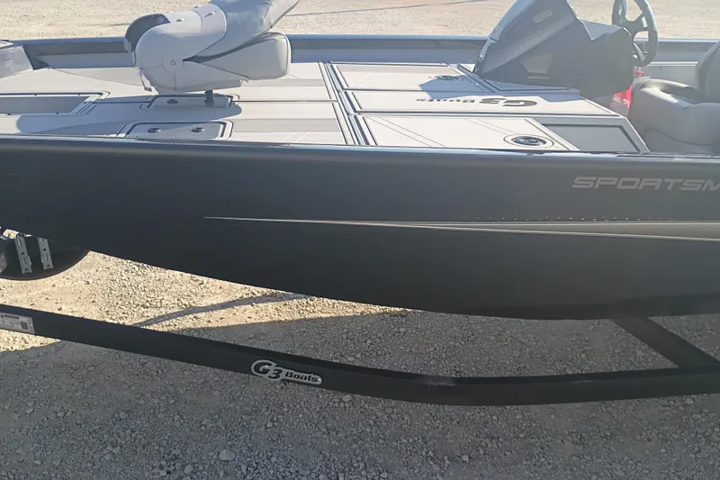 Slide: The Image of 2026 G3 1810SE boat on trailer, featuring sleek design and "Sportsman" branding. - 10
