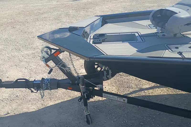 Slide: The Image of 2026 G3 1810SE boat on trailer, parked on gravel surface. - 4