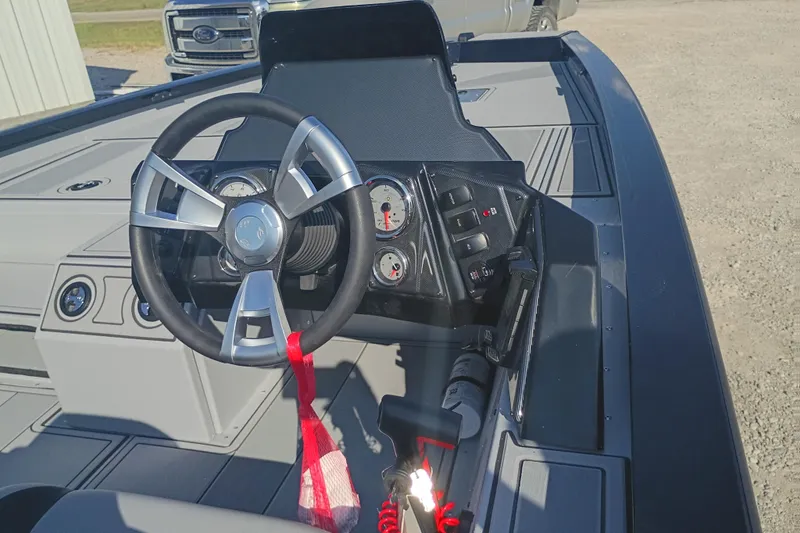 Slide: The Image of Steering console of 2026 G3 1810SE boat with modern controls and gauges. - 8