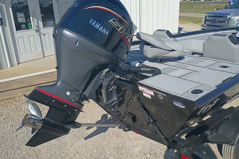 Slide: The Image of 2026 G3 1810SE boat with Yamaha outboard motor, parked outside a building. - 9