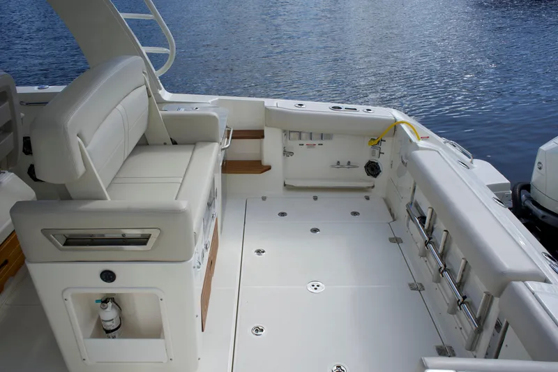 Slide: The Image of 2020 Boston Whaler 350 Realm boat interior, featuring spacious seating and sleek design. - 28