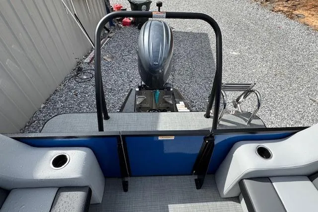 Slide: The Image of 2026 Veranda VV22RC pontoon boat with outboard motor, gray seating, and cup holders. - 12