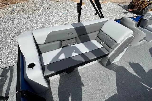 Slide: The Image of 2026 Veranda VV22RC boat interior with gray seating and cup holder on deck. - 13